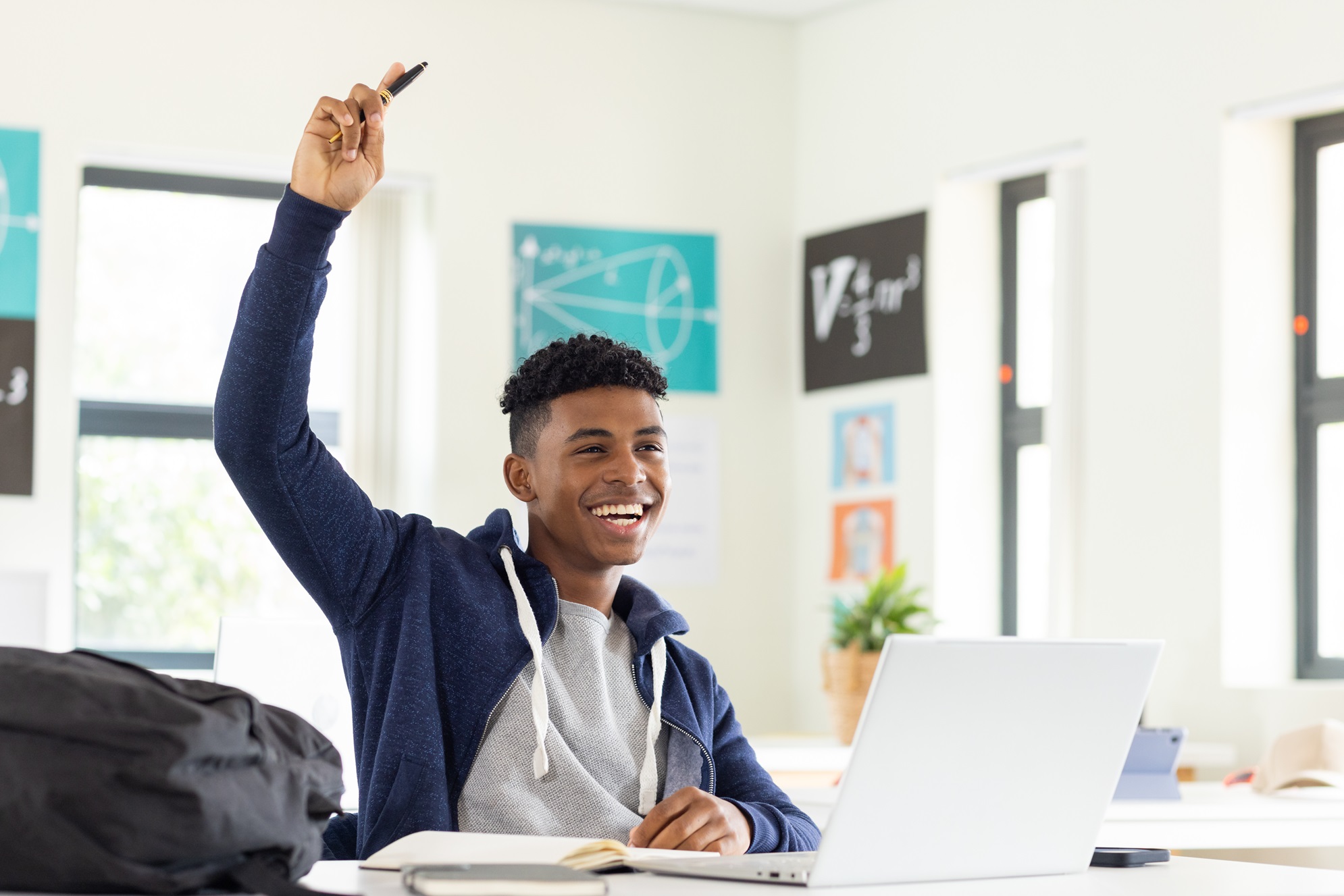Student at the computer in an article about online sat and act exams in 2024 and 2025